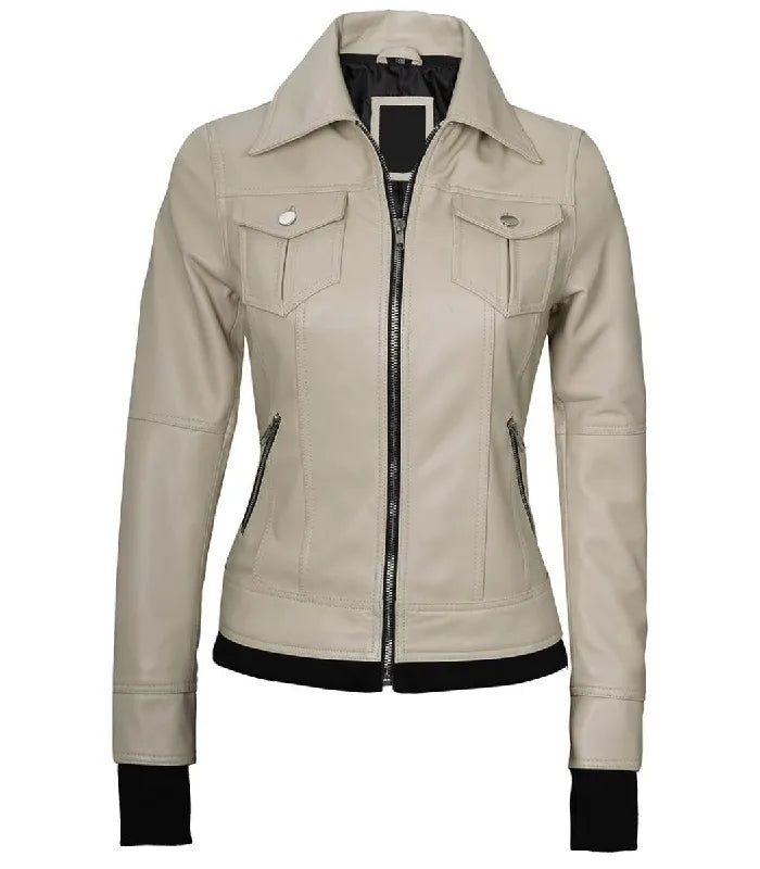 Front view of a women's beige leather bomber jacket without the hood, featuring a pointed collar, buttoned chest pockets, and side zip pockets.