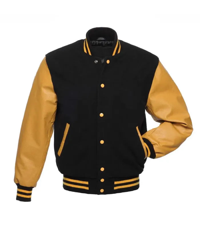 Front pose view of a black wool varsity jacket with gold leather sleeves, gold snap buttons, and one hand inserted in the side pocket.
