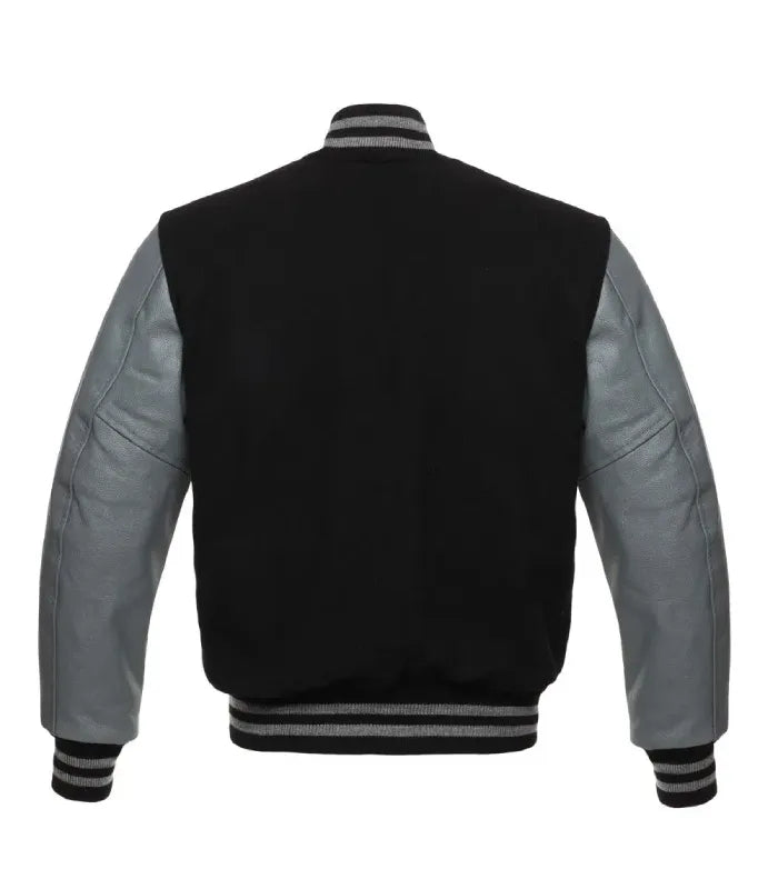 Rear view of a black varsity jacket with grey leather sleeves, plain black wool body, and grey-striped rib-knit collar, hem, and cuffs.