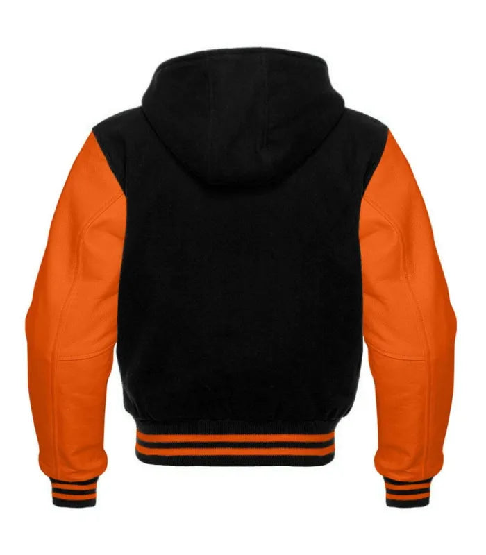 Rear view of a black hooded varsity jacket with orange leather sleeves, plain black wool body, full hood, and orange-striped rib-knit hem and cuffs.
