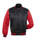 Front view of a black satin varsity jacket with red sleeves, black snap buttons, red-striped ribbed collar and cuffs, and one hand in pocket.