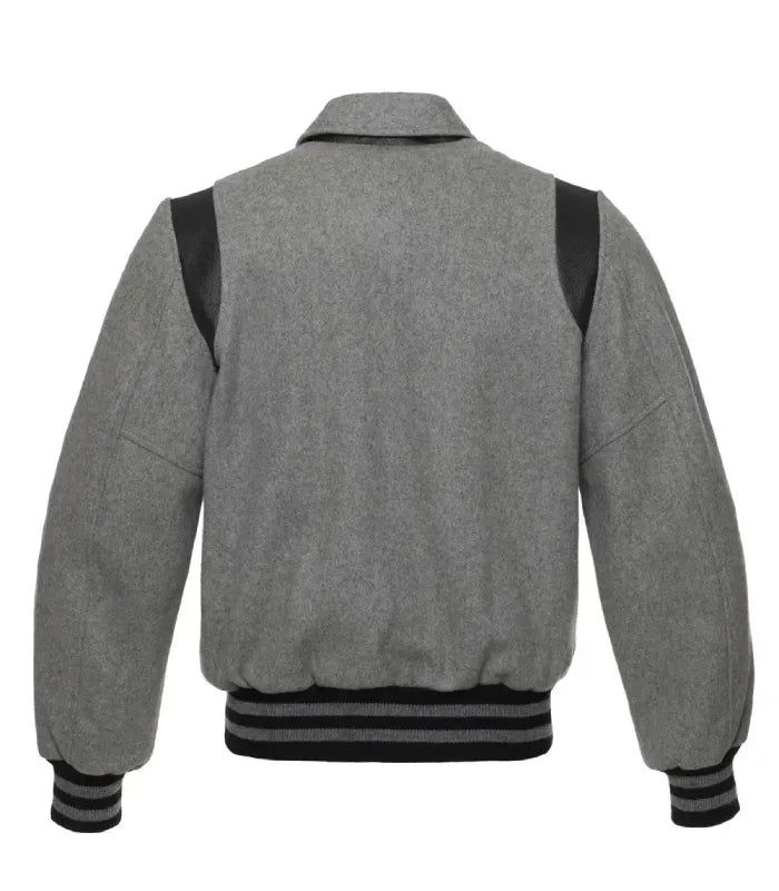 Rear view of grey wool varsity jacket showing fold-down collar and black leather shoulder inserts.