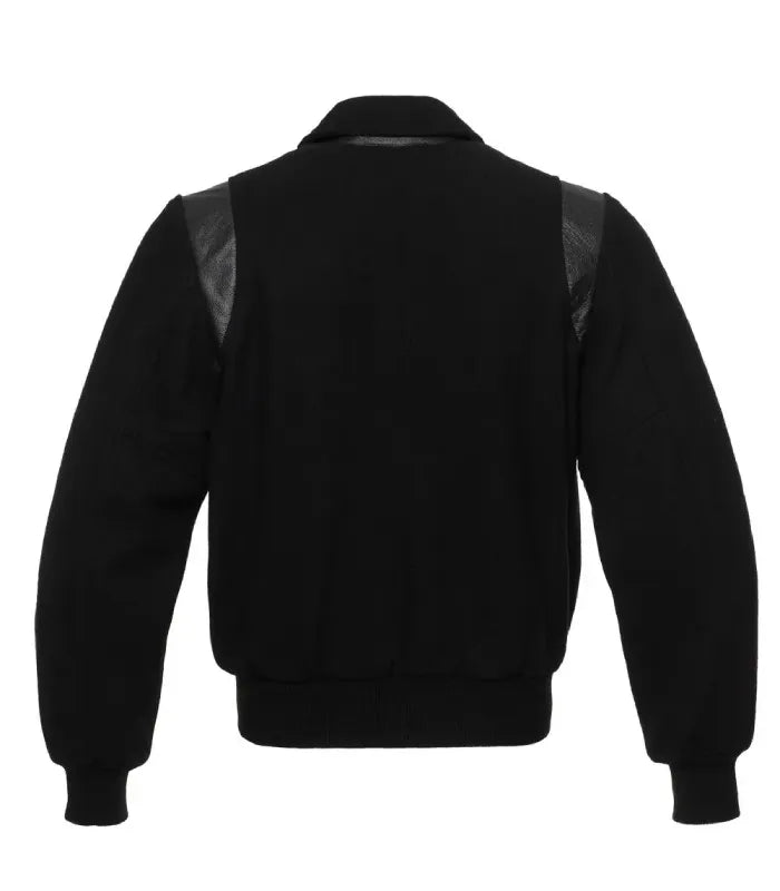 Full back view of matte black wool jacket featuring tonal genuine leather shoulder inserts and solid black waist ribbing.