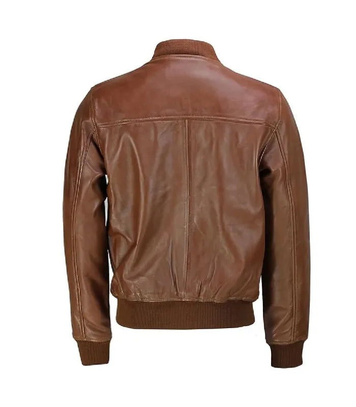 Rear perspective of a brown varsity bomber jacket showing horizontal shoulder yoke stitching, center back seam, and ribbed waistband.