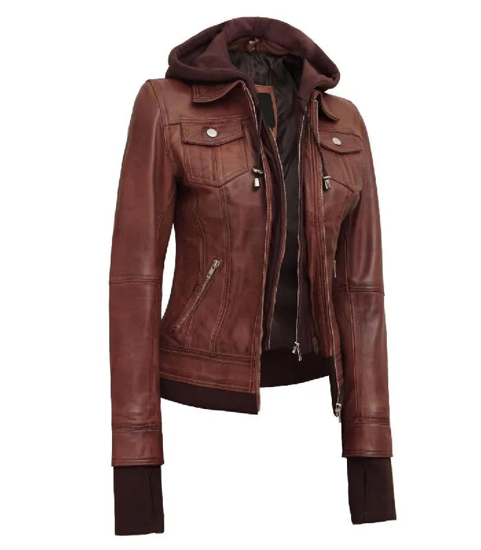 Three-quarter angle view of a women's brown hooded leather bomber jacket featuring a matching brown fabric hood, dual front zippers, and extended wrist cuffs.