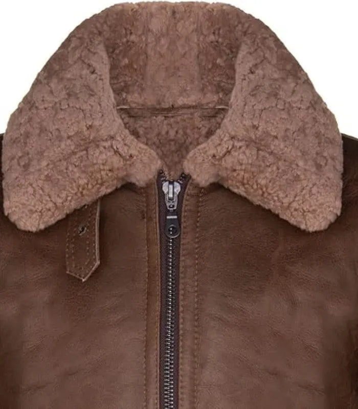 Close-up view of a Brown Bomber Leather Aviator Shearling Jacket featuring a plush brown shearling wool collar, throat latch and zip front closure.