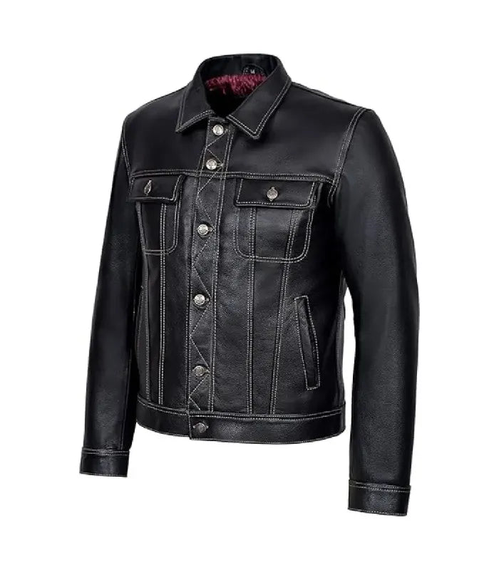 Angled front view of a classic black leather trucker jacket featuring contrast white stitching and buttoned chest pockets.