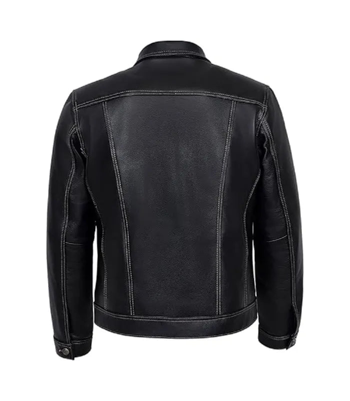 Rear view of a classic black leather trucker jacket highlighting white stitched panel lines and a horizontal back yoke.