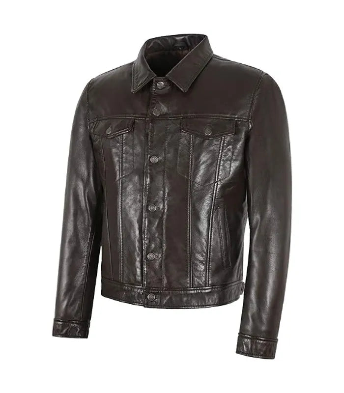 Angled front view of a dark brown leather trucker jacket showing flap chest pockets and button placket.