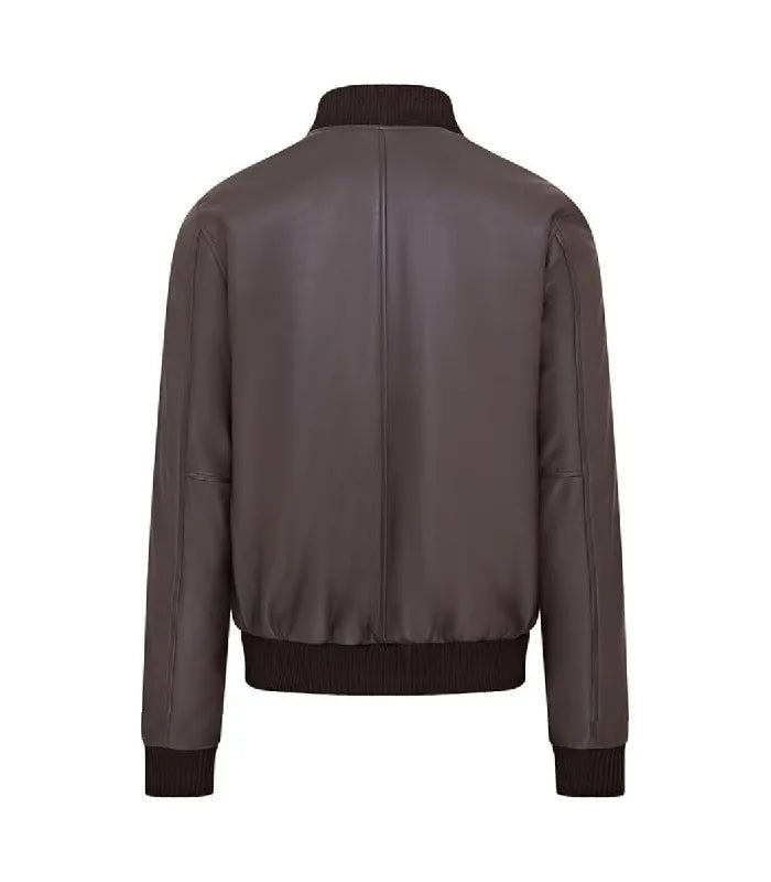 A dark brown real leather bomber jacket shown from the back, featuring ribbed knit collar, cuffs, and hem on a solid white background.