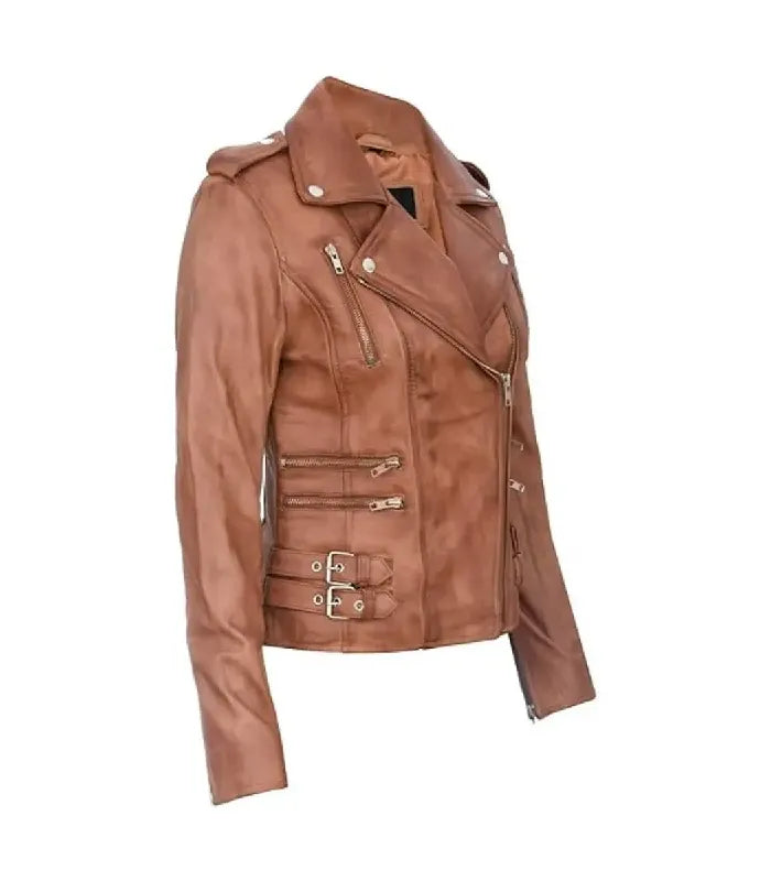 Three-quarter view of Ella tan leather biker jacket showcasing structured fit, silver zippers, side buckles, and inner tan lining.