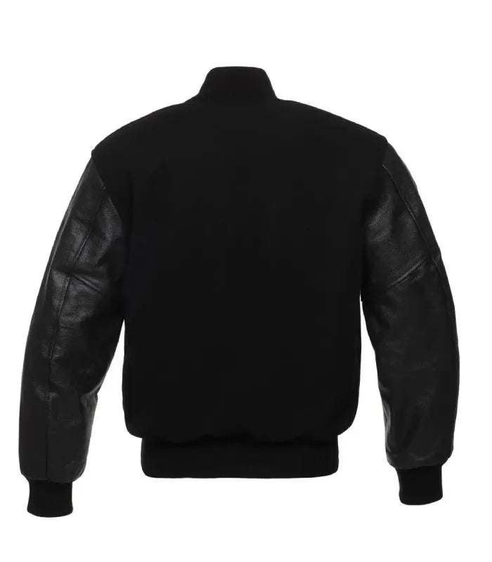 Rear view of an all-black varsity jacket featuring a wool body, leather sleeves, and solid black rib-knit collar, hem and cuffs.