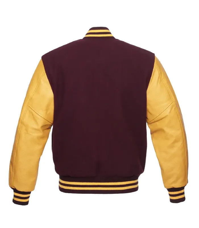 A varsity-style jacket shown from the back, featuring a dark burgundy body and mustard yellow leather-look sleeves, with striped ribbing at the collar, cuffs, and hem.