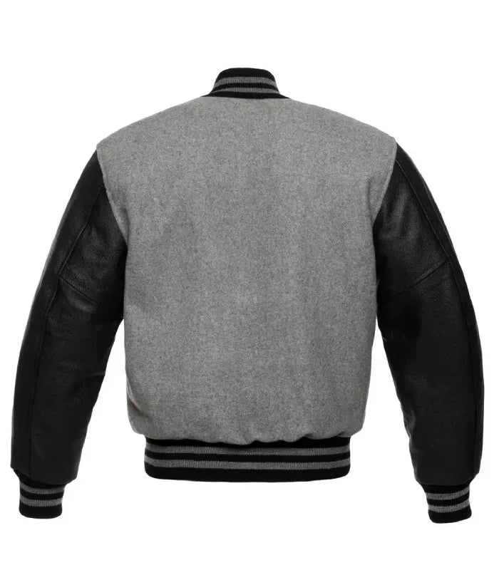Full rear view of heather grey wool varsity jacket featuring contrast black leather sleeves and striped hem.