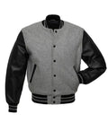 Direct front perspective of grey varsity jacket with genuine black leather sleeves and striped ribbing.