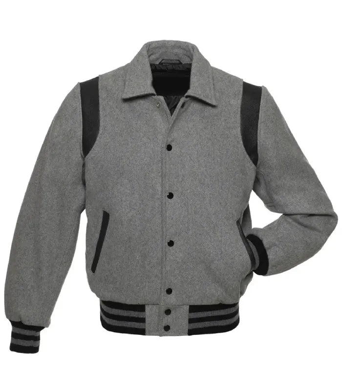 Straight front view of grey wool varsity jacket featuring shirt collar, black snap buttons, and contrast shoulder trim.