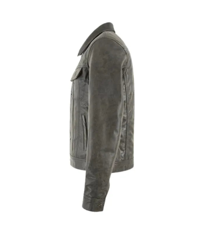 Side profile view of a distressed grey leather trucker jacket displaying sleeve stitching and button cuff details.
