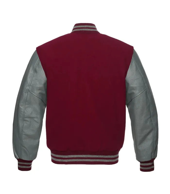 A classic varsity jacket shown from the back, featuring a deep burgundy wool body and smooth silver faux leather sleeves, with striped ribbing on the collar, cuffs, and hem.