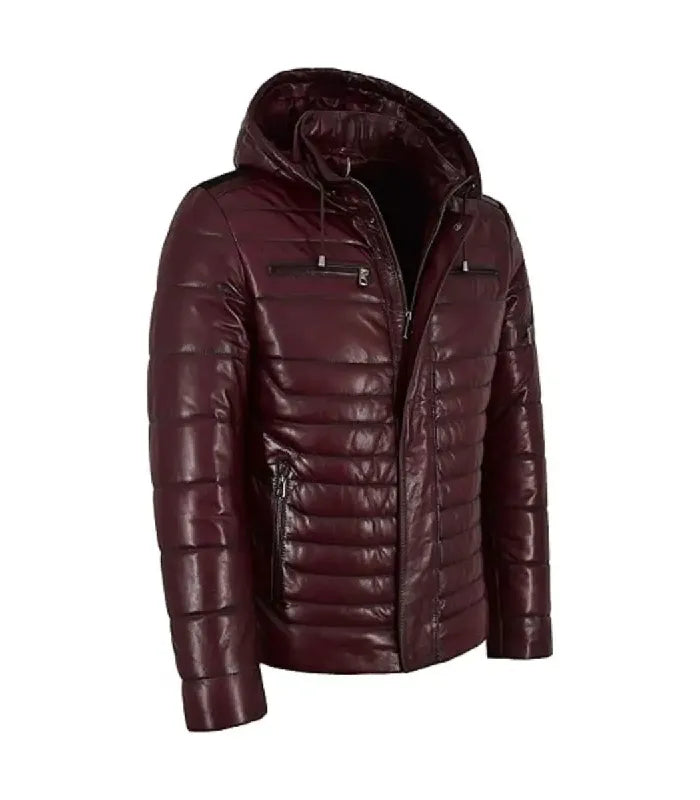 Three-quarter view of a Maroon Hooded Leather Puffer Jacket highlighting silver metal hardware, quilted sleeve detailing, adjustable hood drawstrings, and zipper hand pockets.