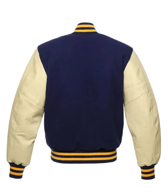 Back profile of dark navy wool varsity jacket featuring cream leather sleeves and gold-striped ribbed trim.