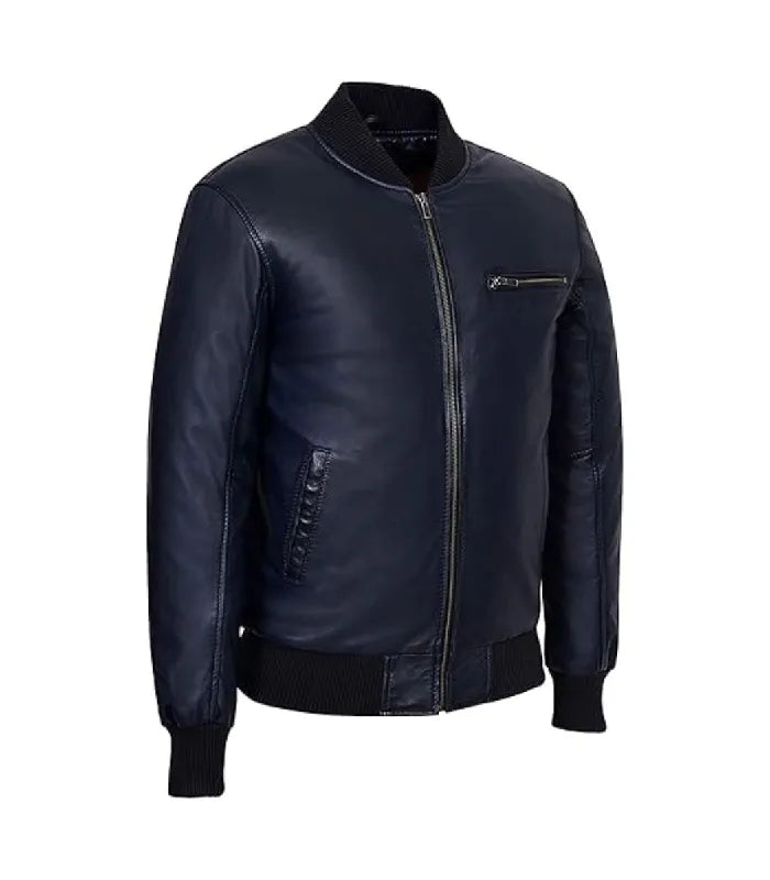 Three-quarter angle view of a navy leather bomber jacket highlighting black ribbed collar, chest pocket, and smooth leather texture.