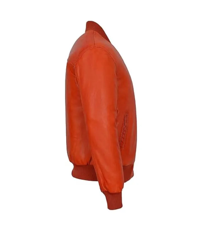Profile view of an orange leather bomber jacket showing sleeve paneling, side welt pocket and matching ribbed cuff.