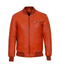 Direct front view of an orange leather bomber jacket featuring horizontal chest zipper pocket, central zip closure, and ribbed waist hem.