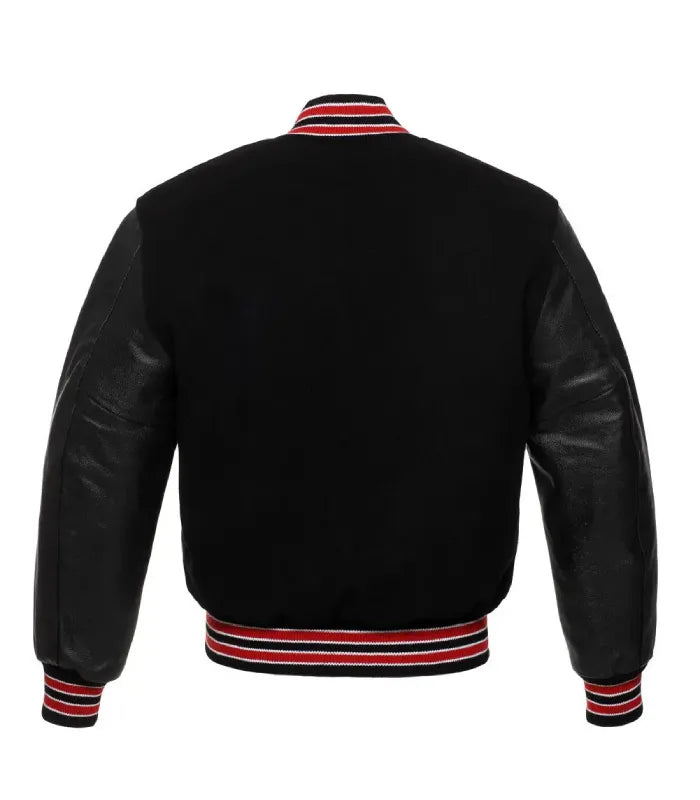 Rear view of a Red Knit Trim Black Varsity Jacket featuring a black wool body, leather sleeves, and striped rib-knit collar, hem, and cuffs.