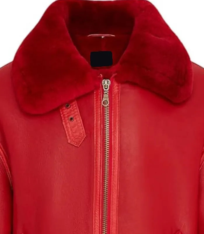 Close-up view of a Red Shearling Aviator Bomber Leather Jacket featuring a plush red shearling collar, throat latch, and heavy-duty front zipper.