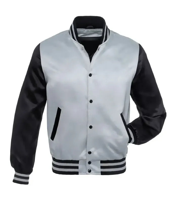 A varsity-style bomber jacket with a silver satin body and black sleeves, featuring a black button closure, striped ribbed collar, cuffs, and hem, and pockets.