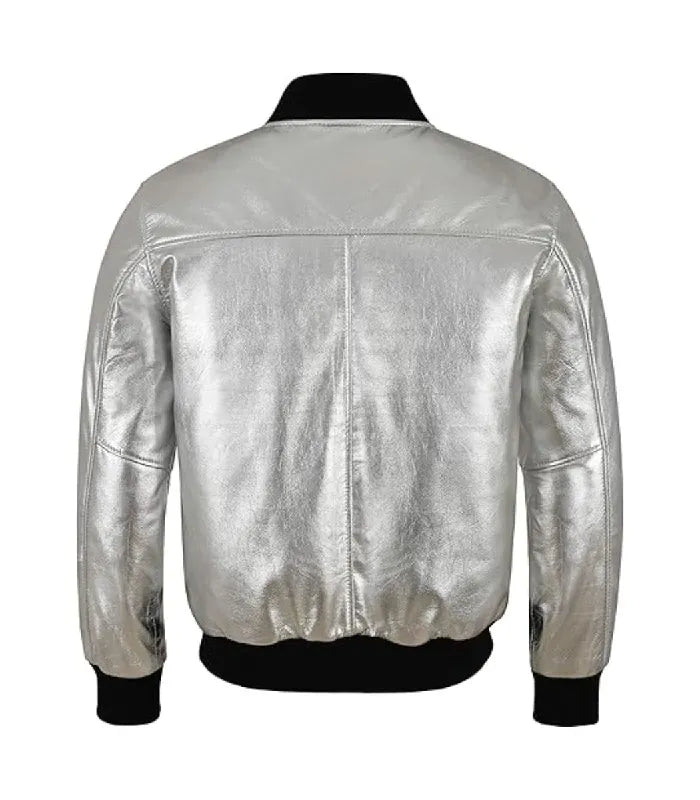 Rear view of a metallic silver leather bomber jacket displaying back yoke stitching and contrasting black ribbed elastic hem.