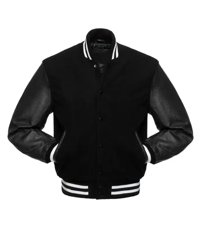 Front view of a black varsity jacket with leather sleeves and white striped ribbed trim, showing both hands tucked into the side pockets.