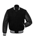 Front pose view of a black varsity jacket with leather sleeves, featuring one hand inserted in the pocket to showcase fit and leather sleeve detail.