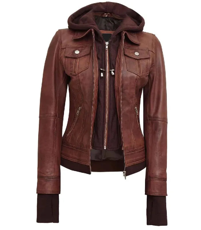Full front zipped view of a women's brown hooded leather bomber jacket with silver metal zippers, buttoned flap chest pockets, and extended storm cuffs.