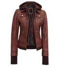 Front open view of a women's brown hooded leather bomber jacket showing a detachable brown fleece hood, double zipper closure layer, and side zip pockets.