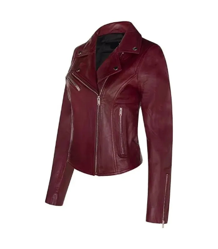 A women's moto jacket in a deep burgundy color, featuring an asymmetrical zipper, a pointed collar, and zippered pockets shown against a plain white background.