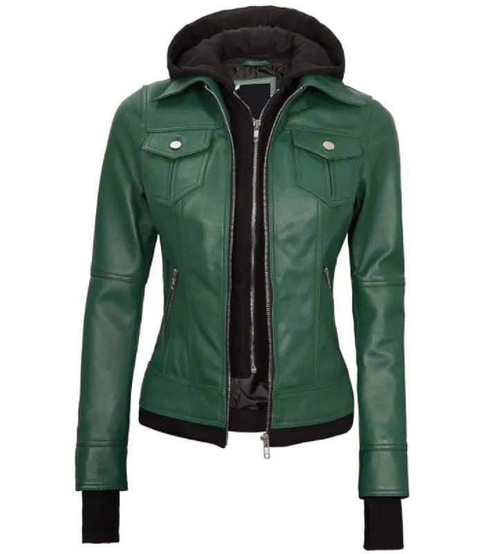 Front zipped view of a women's green hooded leather bomber jacket featuring a black inner fabric hood, dual front zippers, and ribbed waist trim.