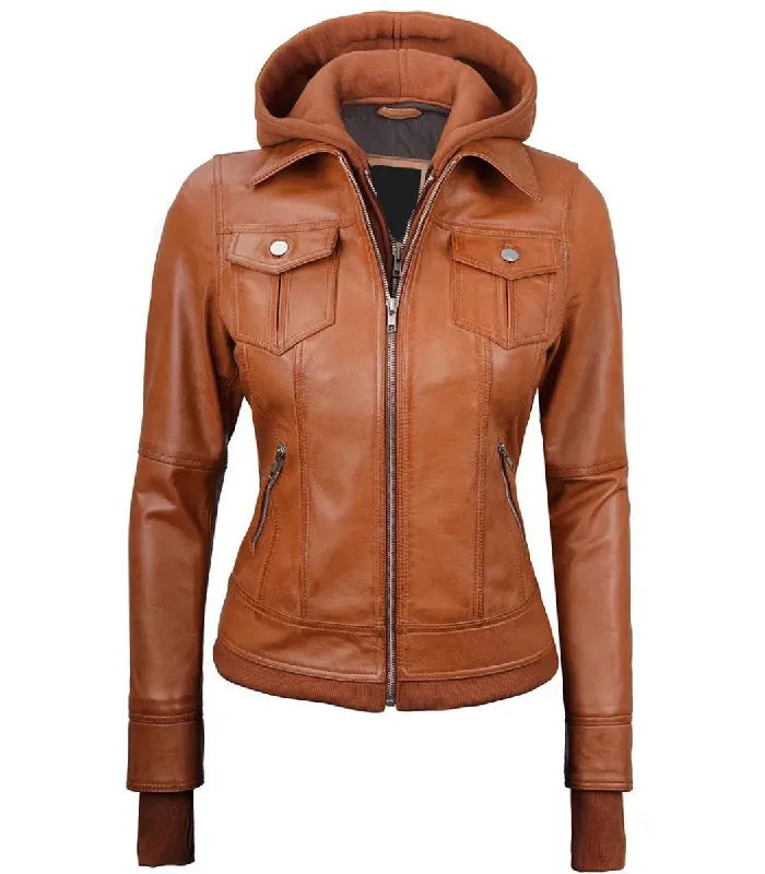 Full front zipped view of a women's tan hooded leather bomber jacket with silver metal zippers, buttoned chest flap pockets, and extended storm cuffs.