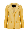 Front view of a women's yellow leather blazer featuring notch lapels, a two-button front closure, and waist flap pockets.