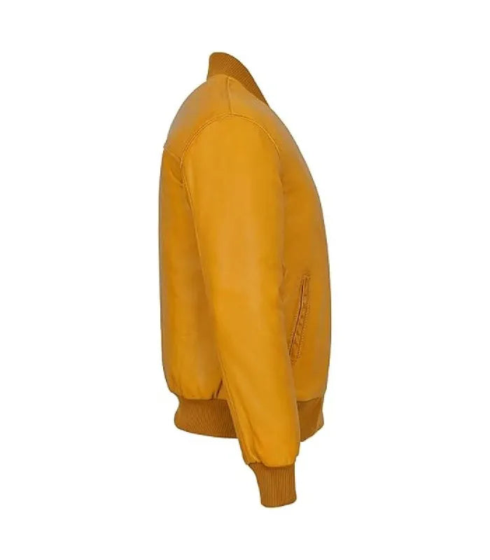 Profile view of a yellow leather bomber jacket showing sleeve paneling, side pocket welt, and ribbed elastic cuff.